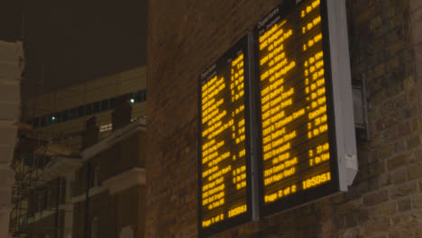 Close-Up-Of-Departure-Board-At-London-Bridge-Rail-Station-In-London-UK-At-Night