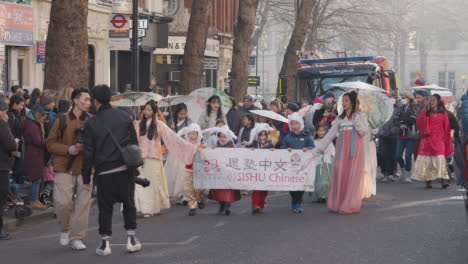 Children-Carrying-Banner-In-Parade-Around-Trafalgar-Square-In-London-UK-In-2023-To-Celebrate-Chinese-New-Year-