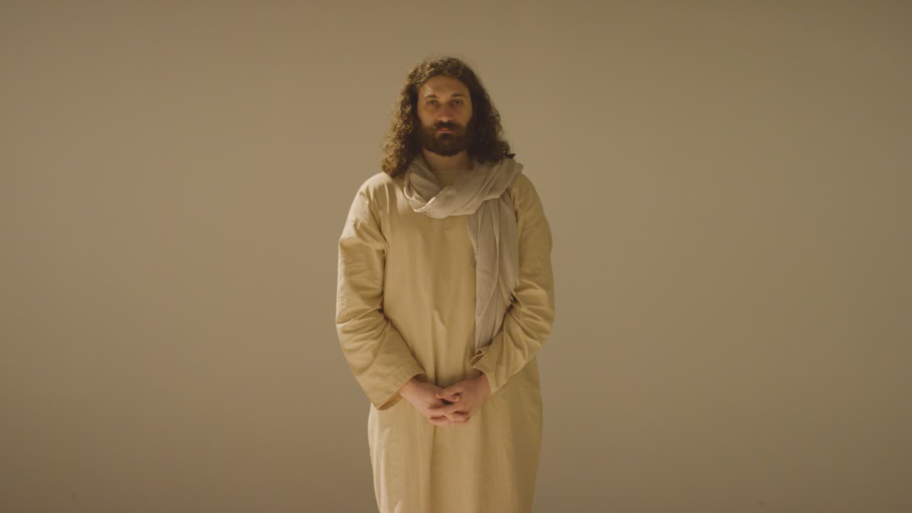 Free stock video - Portrait of man wearing robes with long hair and ...