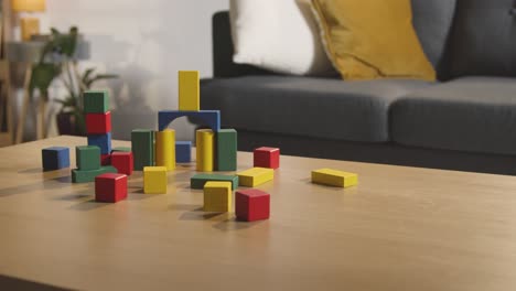 Colourful-Wooden-Building-Blocks-On-Table-At-Home-For-Learning-And-Child-Diagnosed-With-ASD