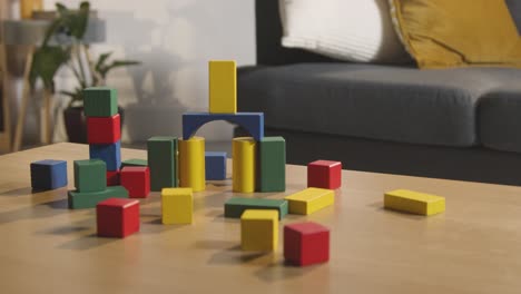 Colourful-Wooden-Building-Blocks-On-Table-At-Home-For-Learning-And-Child-Diagnosed-With-ASD-1
