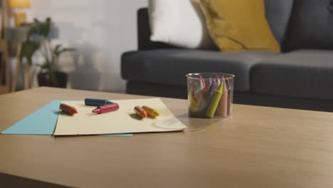 Coloured-Crayons-And-Paper-On-Table-At-Home-For-Child-Diagnosed-With-ASD-