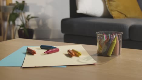 Coloured-Crayons-And-Paper-On-Table-At-Home-For-Child-Diagnosed-With-ASD-1
