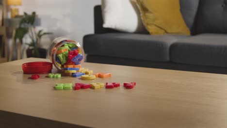 Coloured-Letter-Shape-Toy-On-Table-At-Home-For-Child-Diagnosed-With-ASD-Or-Dyslexia-1