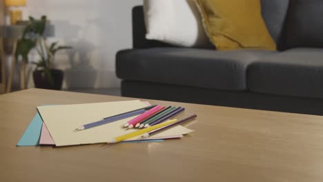 Coloured-Pencils-And-Paper-On-Table-At-Home-For-Child-Diagnosed-With-ASD-1