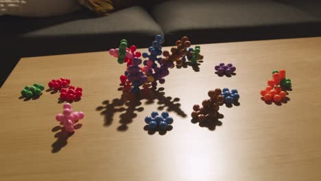 Coloured-Interlocking-Shape-Puzzle-On-Table-At-Home-For-Child-Diagnosed-With-ASD-4