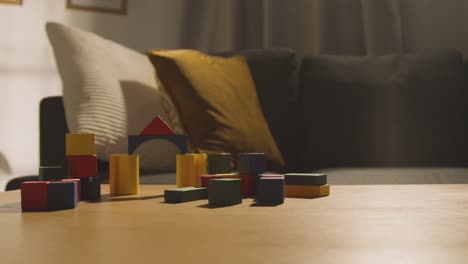 Colourful-Wooden-Building-Blocks-On-Table-At-Home-For-Learning-And-Child-Diagnosed-With-ASD-3