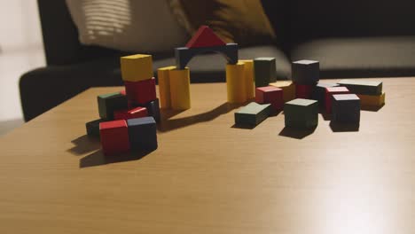 Colourful-Wooden-Building-Blocks-On-Table-At-Home-For-Learning-And-Child-Diagnosed-With-ASD-4