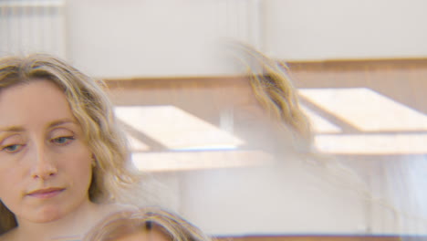 Caleidoscopic-Effect-Of-A-Focused-Blond-Woman-Performing-A-Contemporary-Dance-In-The-Studio