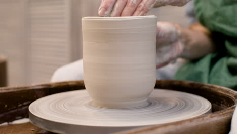 Close-Up-View-Of-Hands-Of-A-Clerk-Modeling-Ceramic-Piece-On-A-Potter-Wheel-In-A-Workshop-2