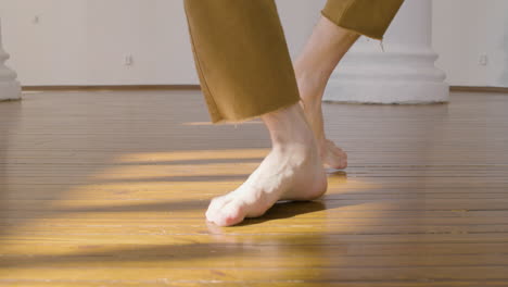 Close-Up-Of-An-Unrecognizable-Man-Performing-A-Contemporary-Dance-In-The-Studio