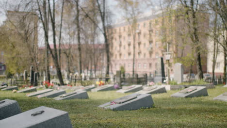 Zoom-In-Of-A-Graveyard-With-Tombstones-In-An-Urban-Area-On-A-Sunny-Day-1