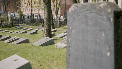 Graveyard-With-Tombstones-In-An-Urban-Area-On-A-Sunny-Day-1