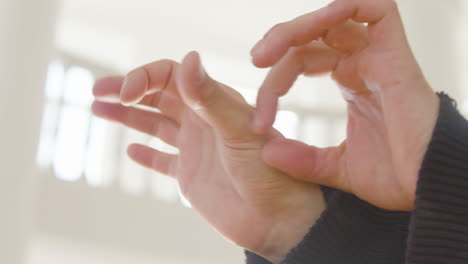 Close-Up-View-Of-Moving-Hands-Of-Contemporary-Dancer-In-The-Studio