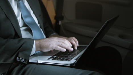 Close-Up-Of-Male-Hands-Typing-On-Laptop