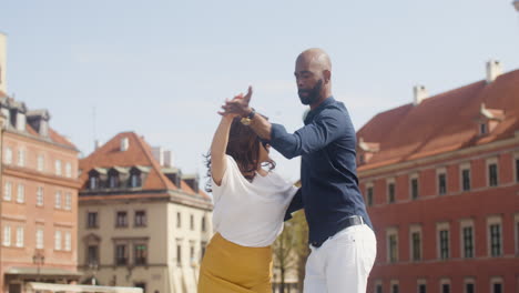 Interracial-Couple-Dancing-Salsa-In-The-Old-Town-Street-1