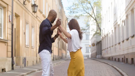 Interracial-Couple-Dancing-Bachata-In-The-Old-Town-Street-3