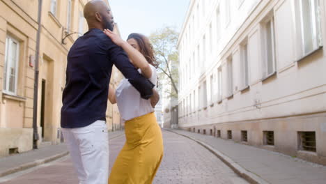 Happy-Interracial-Couple-Dancing-Bachata-In-The-Old-Town-Street-5