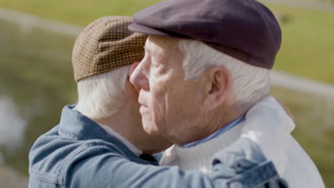 Close-Up-Shot-Of-Loving-Elderly-Couple-Dancing-Outdoors-And-Hugging-In-City-Park