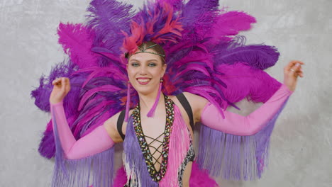 Young-Pretty-Cabaret-Girl-Moving-And-Dancing-In-Feather-Gown