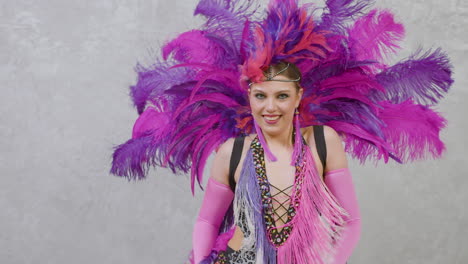 Female-Dancer-In-A-Feather-Outfit-Performing-A-Cabaret-Dance
