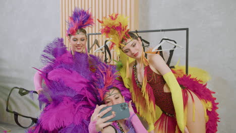 Three-Pretty-Female-Dancers-Taking-Pictures-Of-Themselves-With-Colorful-Outfits
