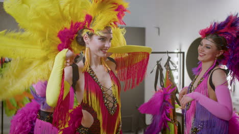 Beautiful-Dancers-With-Feather-Colorful-Gowns-Getting-Ready