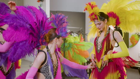 Pretty-Cabaret-Girls-With-Feather-Colorful-Dresses-Getting-Ready