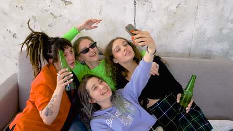 Four-Girls-Having-Good-Time-And-Taking-Pictures-Of-Themselves-With-A-Smartphone