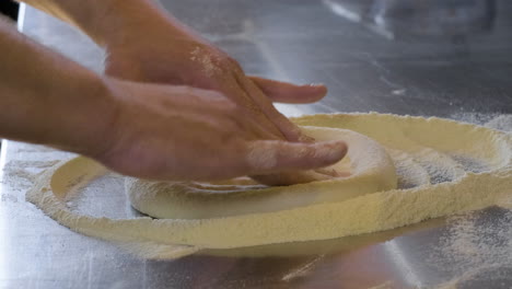 Close-Up-Of-Hands-Preparing-Fresh-Pizza-Dough