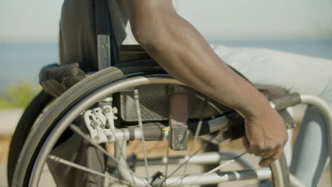 Closeup-Of-Black-Man-With-Paraplegia-Riding-Wheelchair