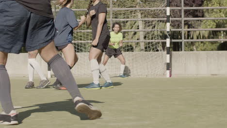 Slow-Motion-Of-An-Unrecognizable-Female-Football-Player-Taking-A-Free-Kick-While-The-Opponent-Team-Defending-The-Goal-Successfully-And-Celebrating