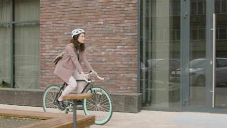 Young-Woman-In-Formal-Clothes-Going-To-Work-On-Bicycle-1