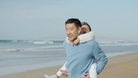 Japanese-father-walking-along-seashore-with-his-daughter-on-his-back-and-telling-her-stories