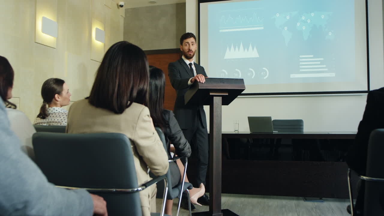 Free stock video Camera zoom out on caucasian businessman talking on