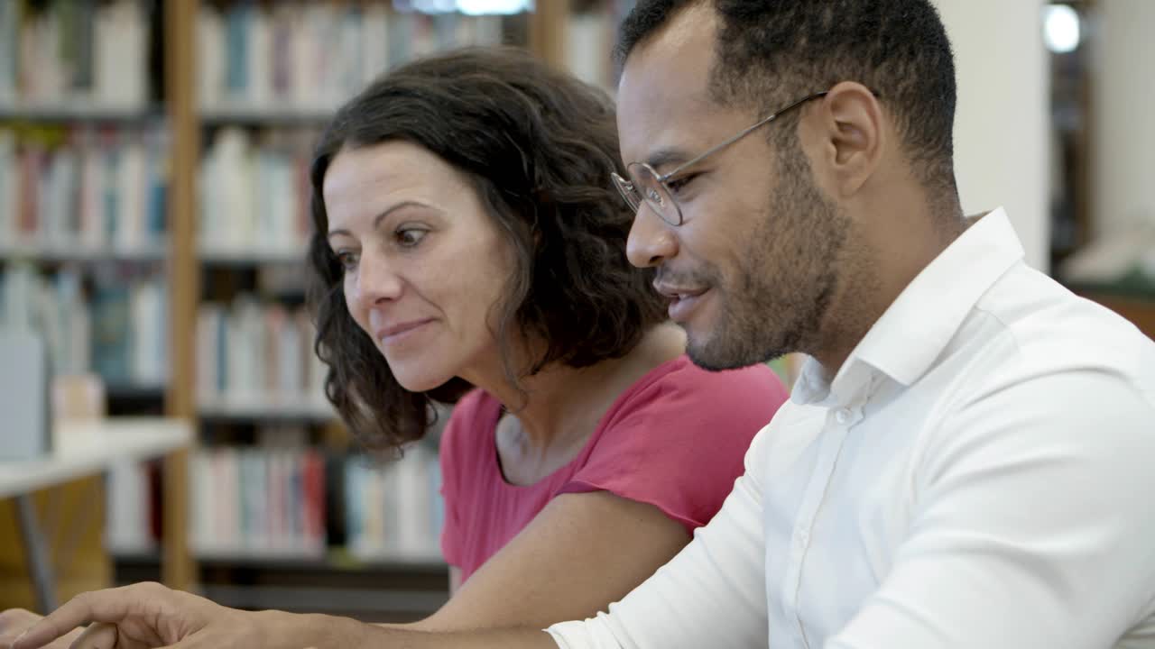 Free stock video - Smiling people communicating at library