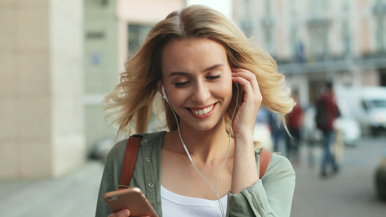 Free stock video - Close-up view of caucasian blonde woman walking down ...