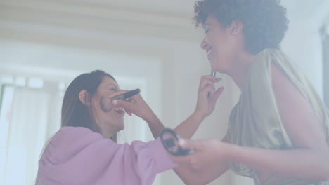 Two-female-friends-doing-makeup-on-each-other,-having-fun