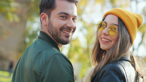 Rear-view-of-Caucasian-woman-wearing-glasses-and-beanie-and-caucasian-man