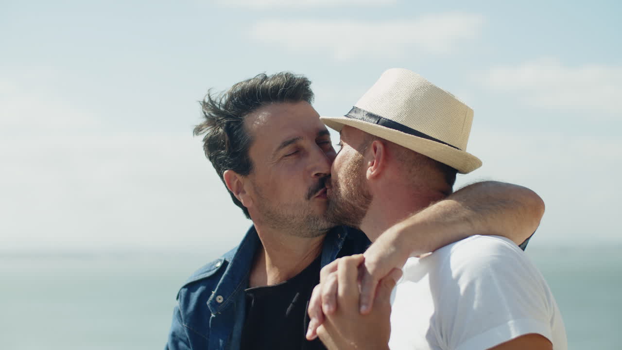 Medium Shot Of Gay Couple Kissing Outdoors In Windy Weather Free Stock Video  Footage Download Clips People