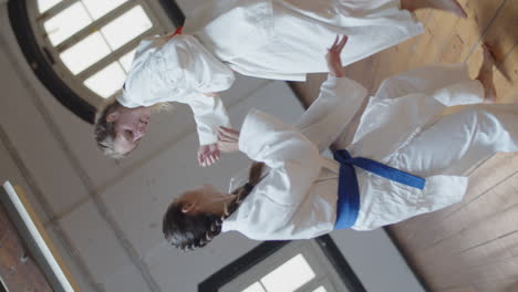 360-degree-shooting-of-girls-practicing-karate-in-gym