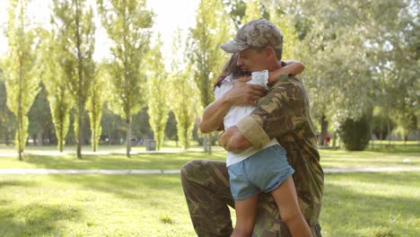 Excited-girl-running-to-military-dad's-open-arms