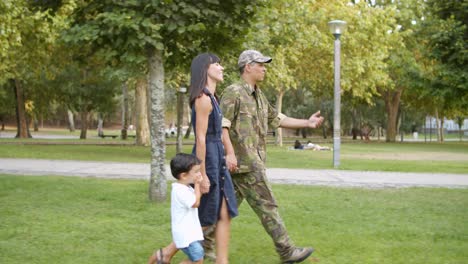 Happy-military-man-enjoying-leisure-time-in-park-with-his-family