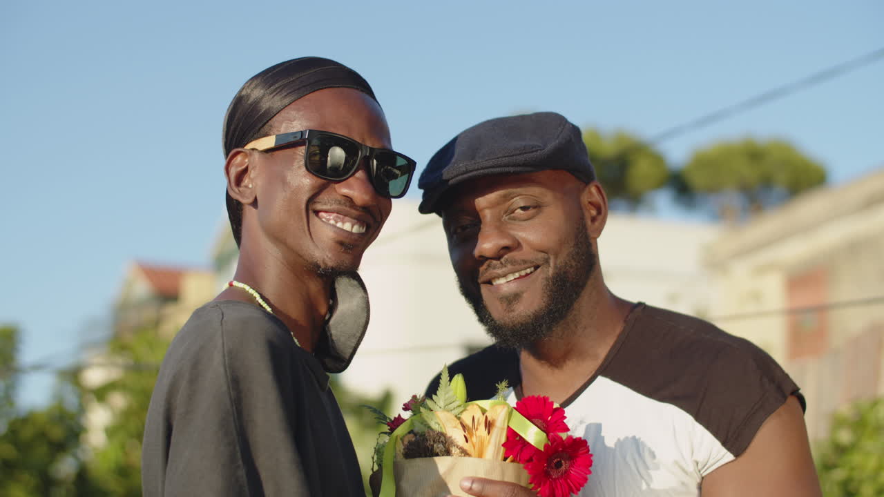 Free stock video Portrait of happy gays with bouquet of flowers
