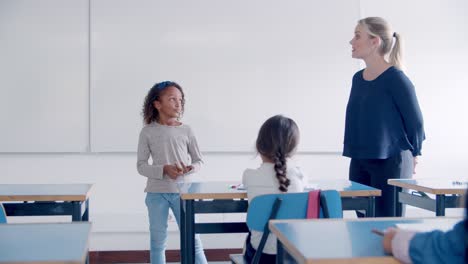 468px x 264px - Free stock video - Friendly female school teacher explaining task to little  student