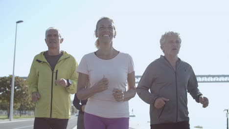 Happy-group-of-people-jogging-together-outdoors