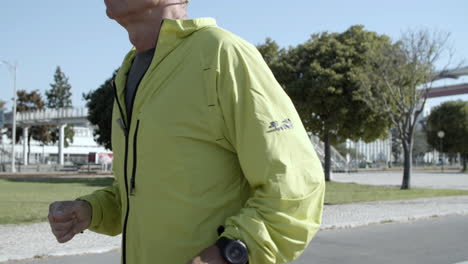 Senior-jogger-wearing-smartwatch