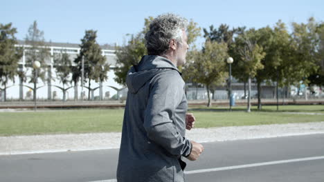 Elder-male-runner-jogging-outside