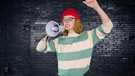 Young-Caucasian-environmental-activist-protesting-with-megaphone-indoors