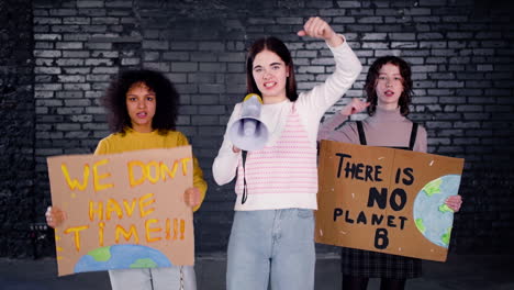 Young-female-environmental-activists-protesting-against-climate-change-inaction